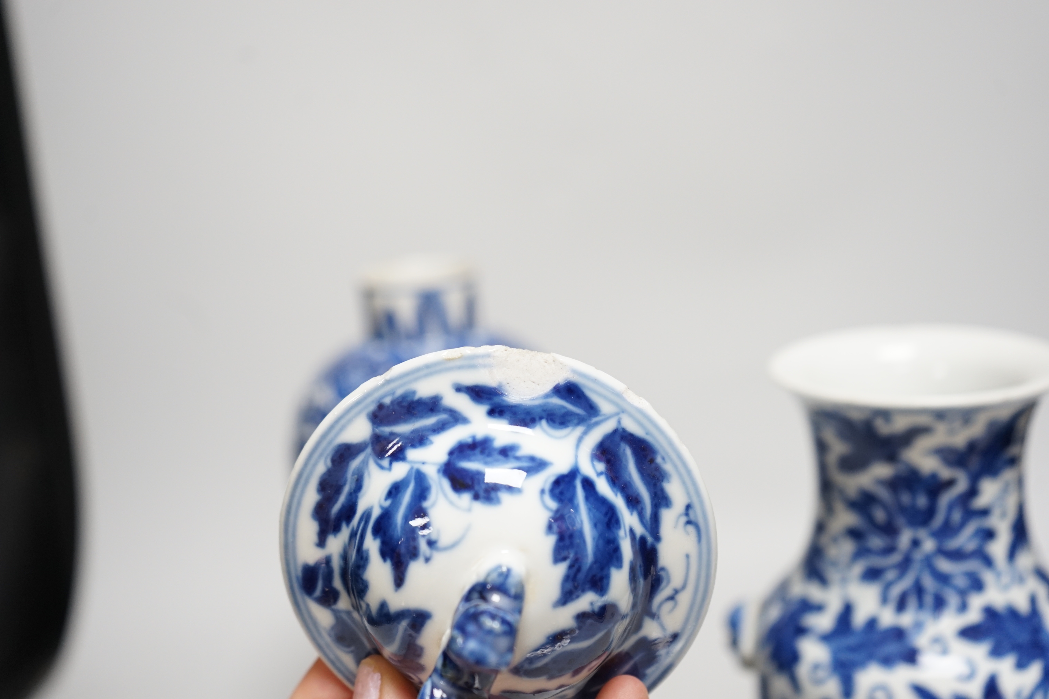 A late 19th century Chinese blue and white 'Lotus' vase and cover and another similar (2), tallest 31cm